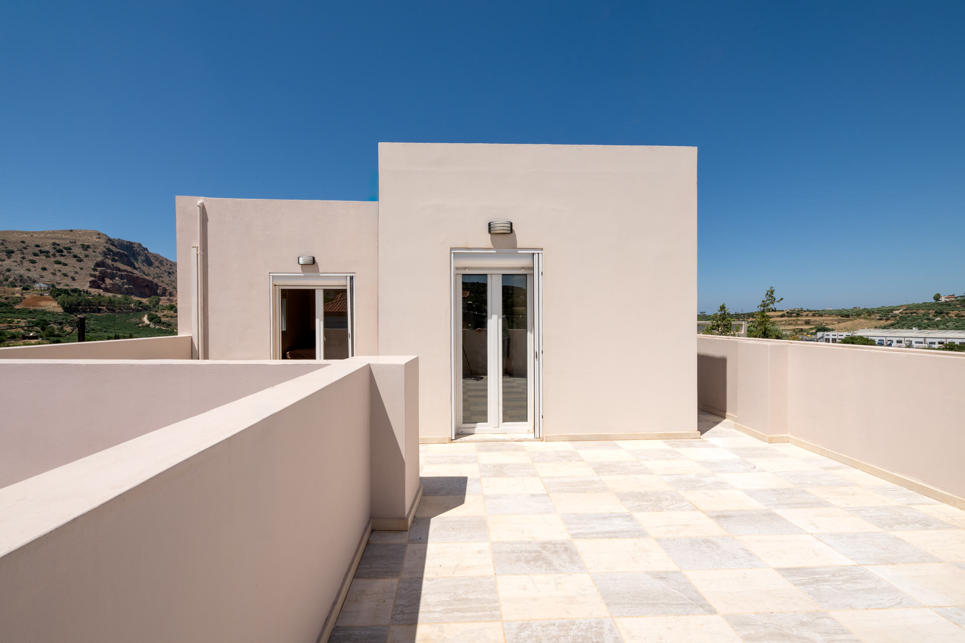 Roof terrace entrance and surrounding parapet with wide outdoor space